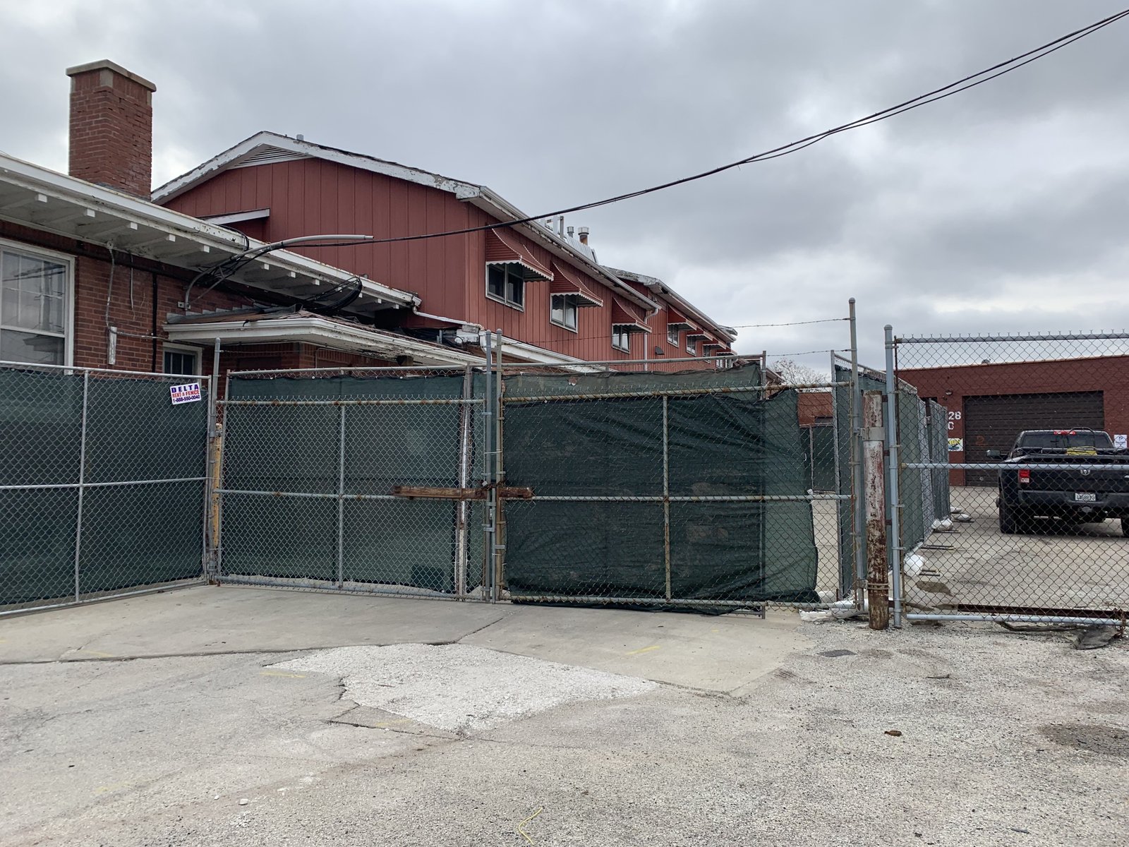 Commercial demolition site with excavator