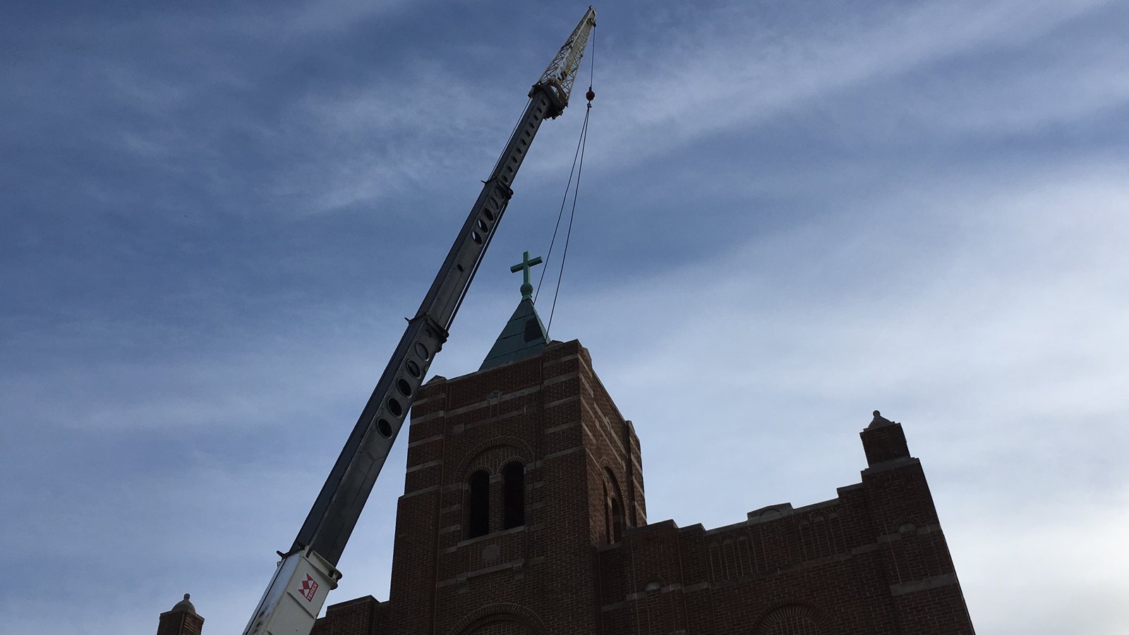 Crane removing church steeple
