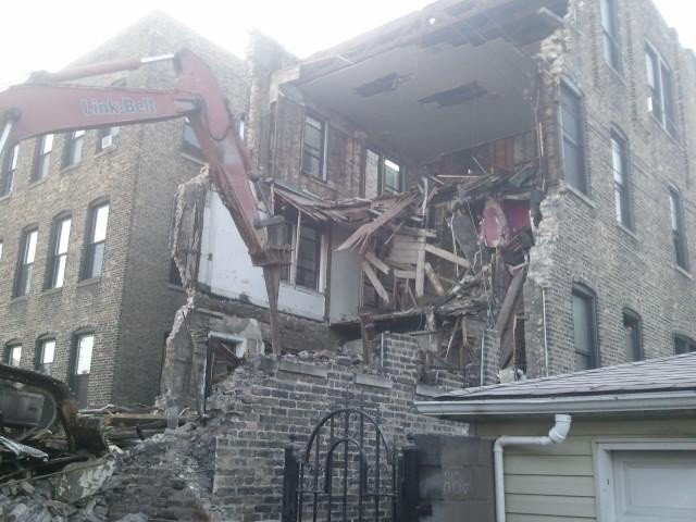 Excavator working on a commercial demolition site