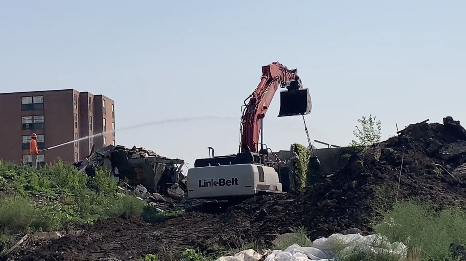 Excavator working at demolition site